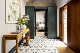 entrance hall with tiled floor and dark paint view to bedroom