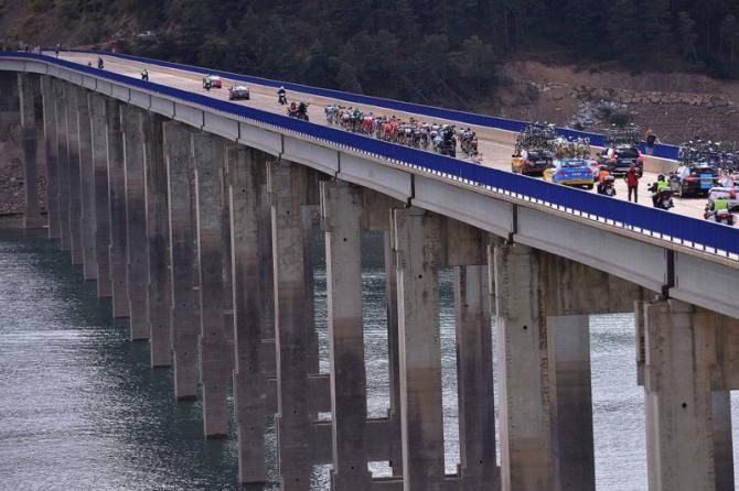The peloton crosses one of several bridges on the stage