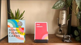 Mindfulness Cards on a shelf surrounded by houseplants