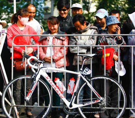 The local fans watching the rider bike near the sign off stage