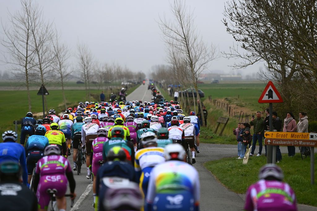 WEVELGEM BELGIUM MARCH 27 A general view of the Peloton passing through De Moeren during the 84th GentWevelgem in Flanders Fields 2022 Mens Elite a 2488km one day race from Ypres to Wevelgem GWE22 WorldTour on March 27 2022 in Wevelgem Belgium Photo by Tim de WaeleGetty Images