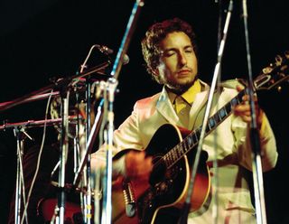 Bob Dylan performs at Isle of Wight on August 31, 1969, using Harrison’s Gibson J-200