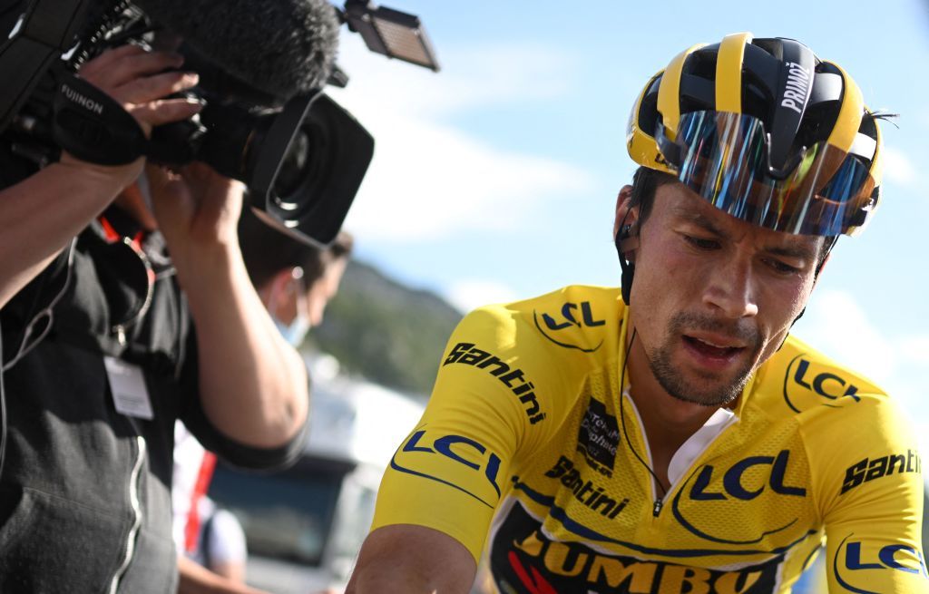 Overall race winner JumboVisma teams Slovenian rider Primoz Roglic R reacts at the end of the eighth and last stage of the 74th edition of the Criterium du Dauphine cycling race 1375 km between SaintAlbanLeysse and Plateau de Solaison on June 12 2022 Photo by Marco BERTORELLO AFP Photo by MARCO BERTORELLOAFP via Getty Images