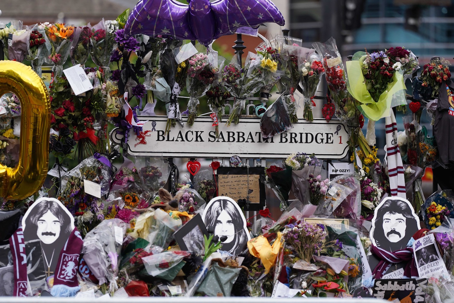 BIRMINGHAM, UNITED KINGDOM - JULY 30: Flowers and notes are seen on the Black Sabbath Bridge in Birmingham, United Kingdom on July 30, 2025, placed ahead of the funeral procession of Ozzy Osbourne, the legendary British heavy metal musician and frontman of Black Sabbath, who passed away at the age of 76. (Photo by Ioannis Alexopoulos/Anadolu via Getty Images)