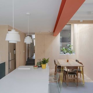 modern kitchen extension with bare wood kitchen and exposed steel beam