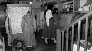 Guests peruse dresses in the Laura Ashley Madison Avenue boutique on May 31, 1983 in New York City