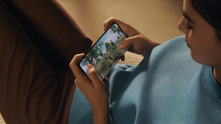 Woman playing games on the Oppo Find X5 Pro