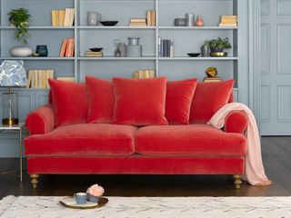 a red sofa in a living room