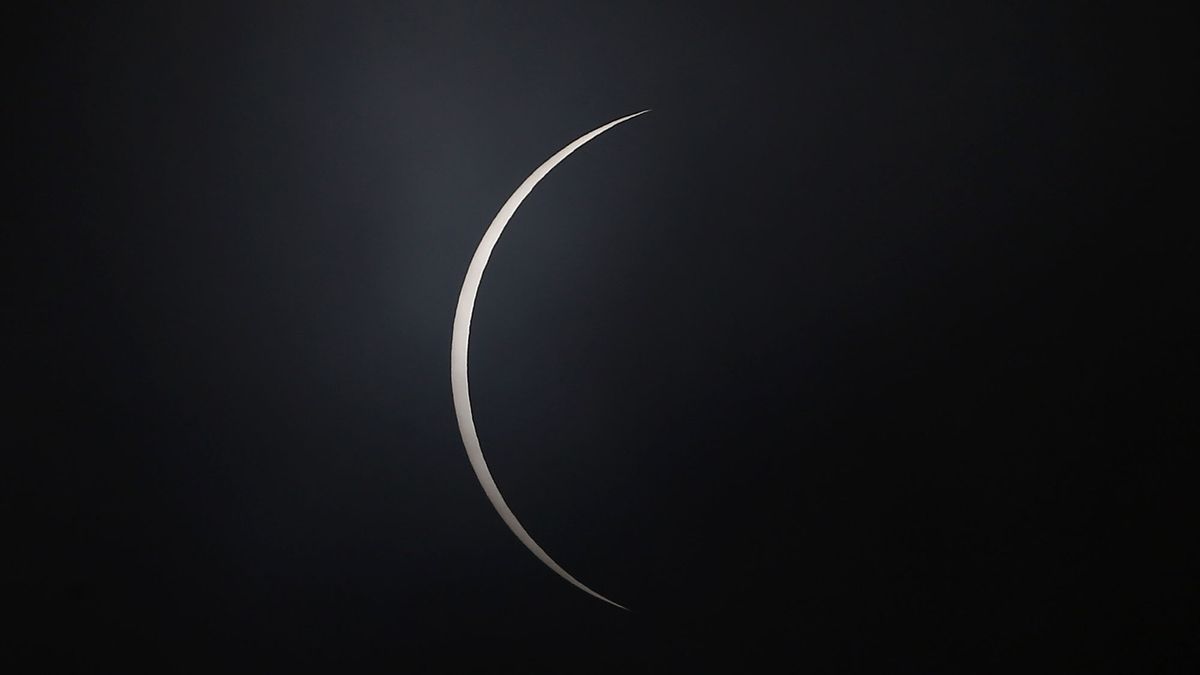 A shred of sun appears after totality as the moon moves across the sun during a total solar eclipse on Dec. 14, 2020, in Teodoro Schmit, Chile.