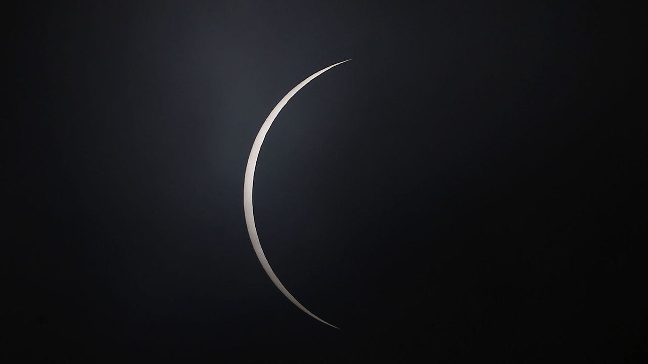 A shred of sun appears after totality as the moon moves across the sun during a total solar eclipse on Dec. 14, 2020, in Teodoro Schmit, Chile.