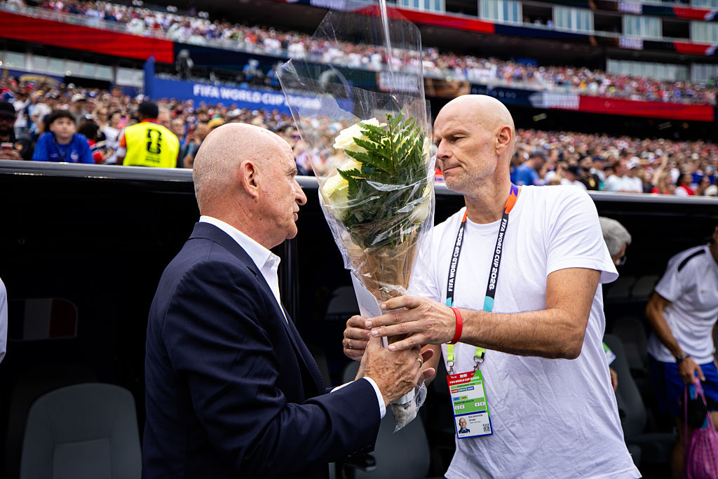 FOXBOROUGH, MASSACHUSETTS - JUNE 26: France assistant coach Guy Stephan receives flowers from Norway head coach Stale Solbakken as a gesture of sympathy following the recent passing of Didier Deschamps mother prior to the FIFA World Cup 2026 Group I match between Norway and France at Boston Stadium on June 26, 2026 in Foxborough, Massachusetts. (Photo by MB Media/Getty Images)
