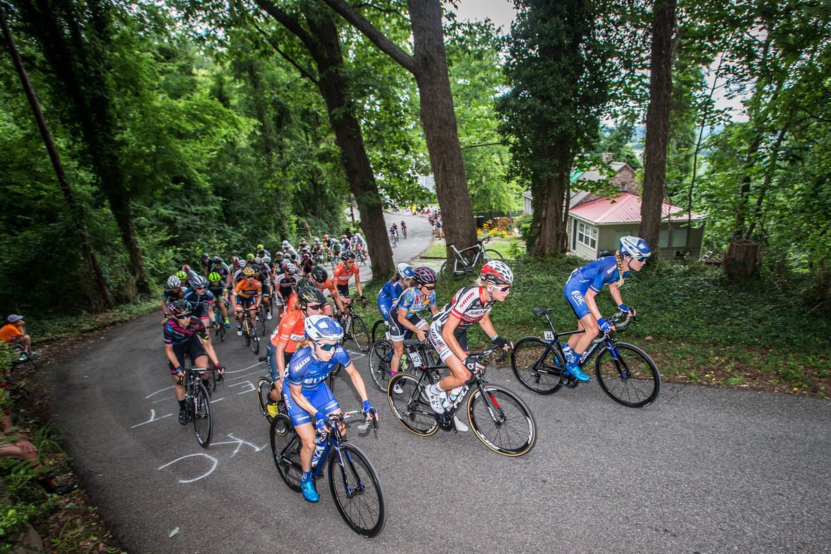 The womens field nears the top of the climb