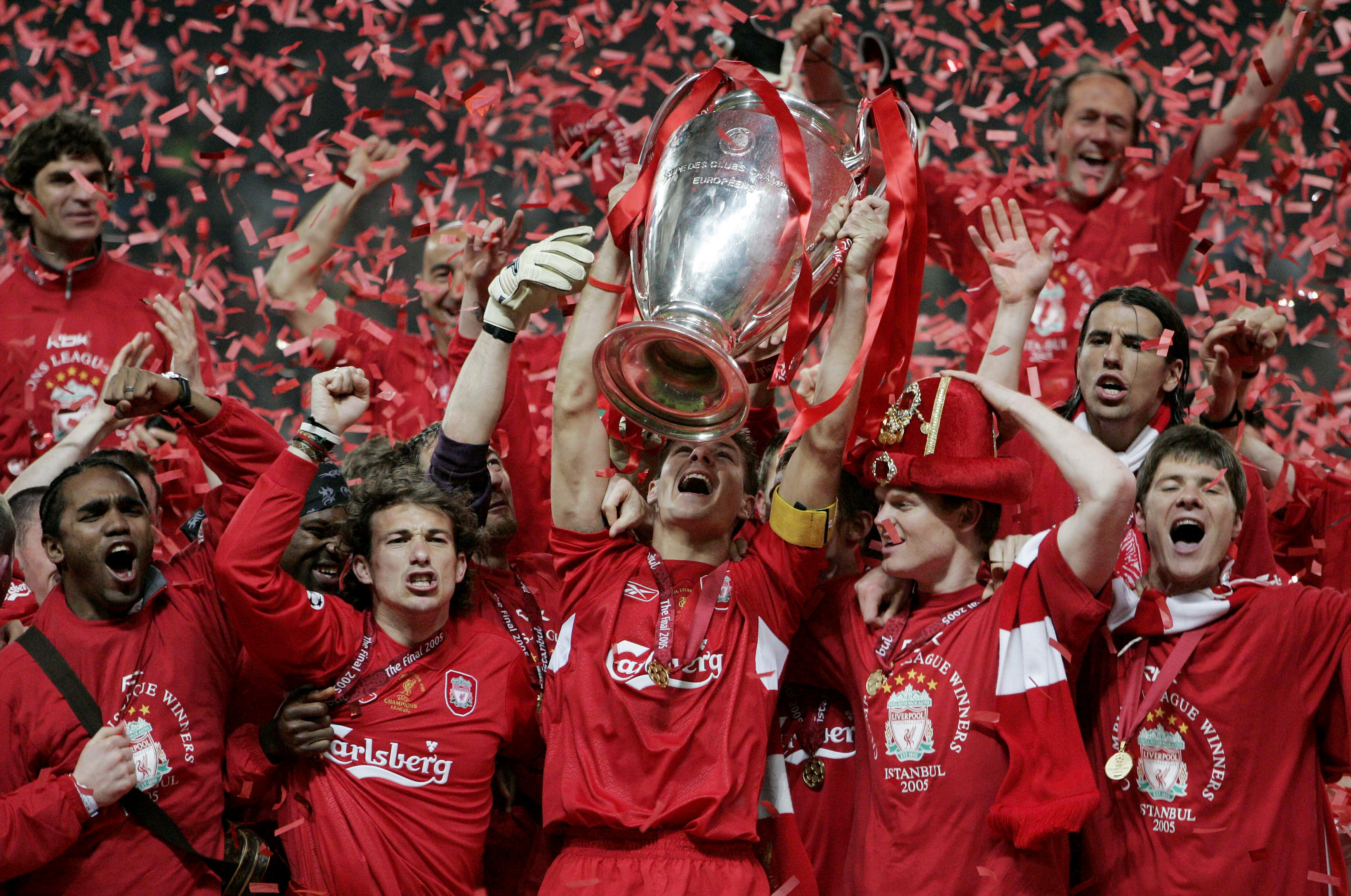 Steven Gerrard lifts the Champions League trophy as Liverpool players celebrate victory over AC Milan in the 2005 final in Istanbul.