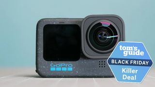 An image of the GoPro Hero12 Black on a tabletop with a teal background