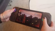 PC gaming handheld on white table