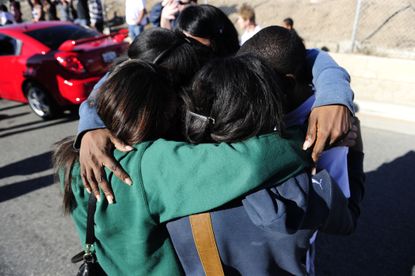 Students hug after a school lockdown at Gardena High School in California.