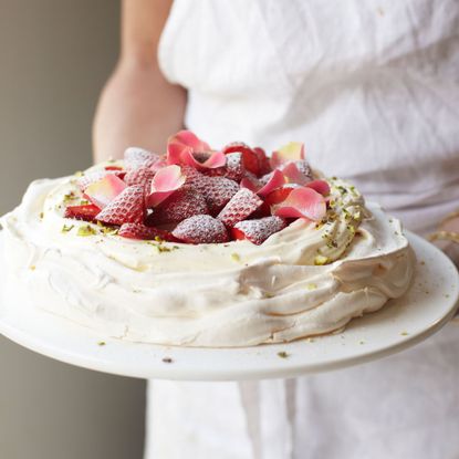 Rosewater and pistachio pavlova with strawberries photo