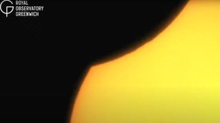 partial solar eclipse, section of the sun begins to be eclipsed.