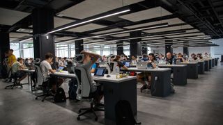 open plan office with workers at desks