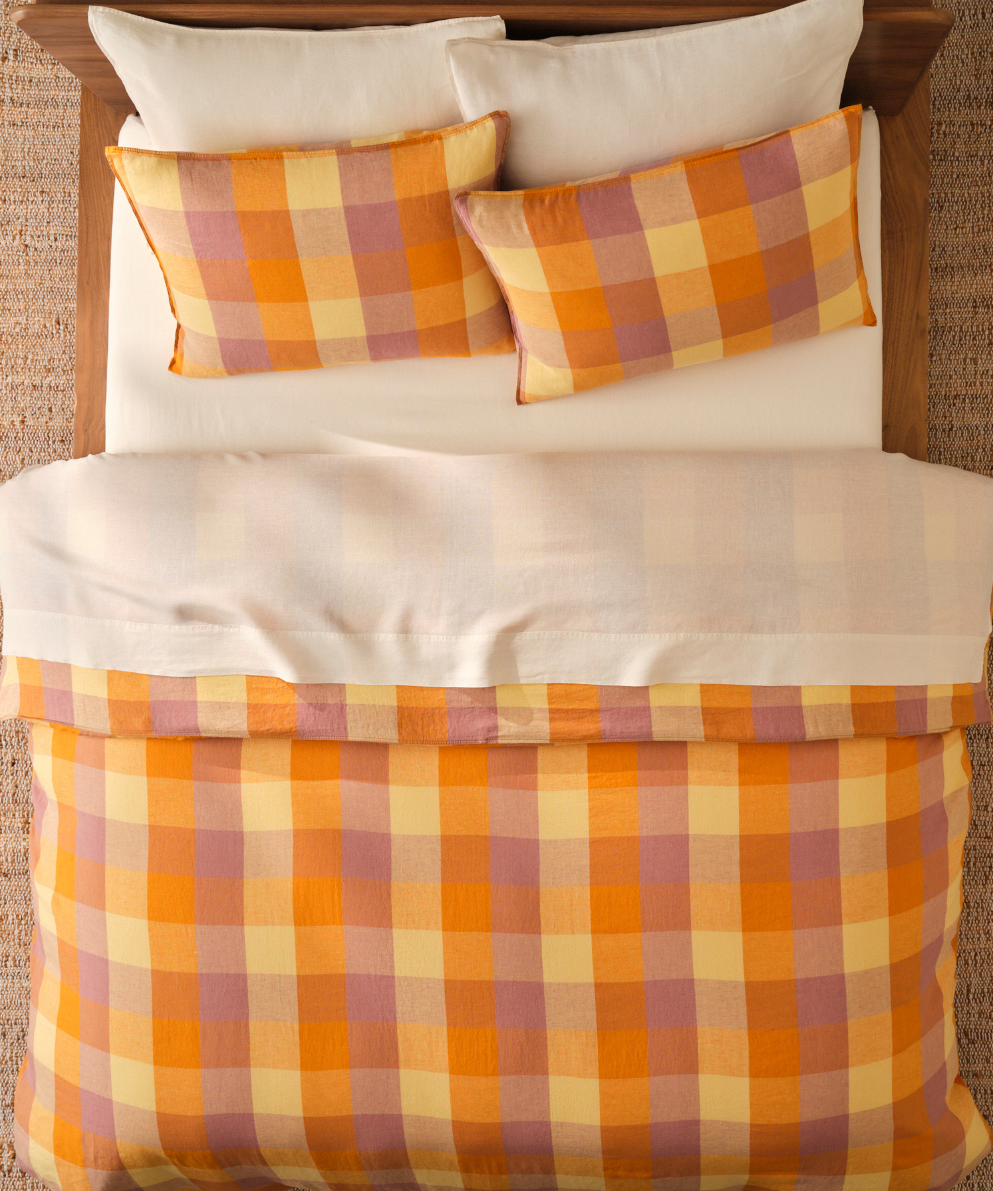 Brooklinen plaid bedding for fall 2026 styled with clean ivory sheets in a neutral bedroom