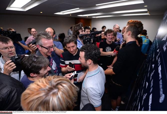 Mark Cavendish is swamped by the media in Dubai