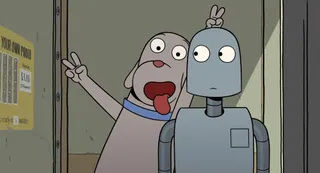 An animated picture of a dog holding up peace signs and hanging its tong out while taking a picture with a robot, who side-eyes the dog. From 'Robot Dreams.'