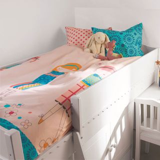 kids bed with cartoon printed bedsheet and bunny rabbit