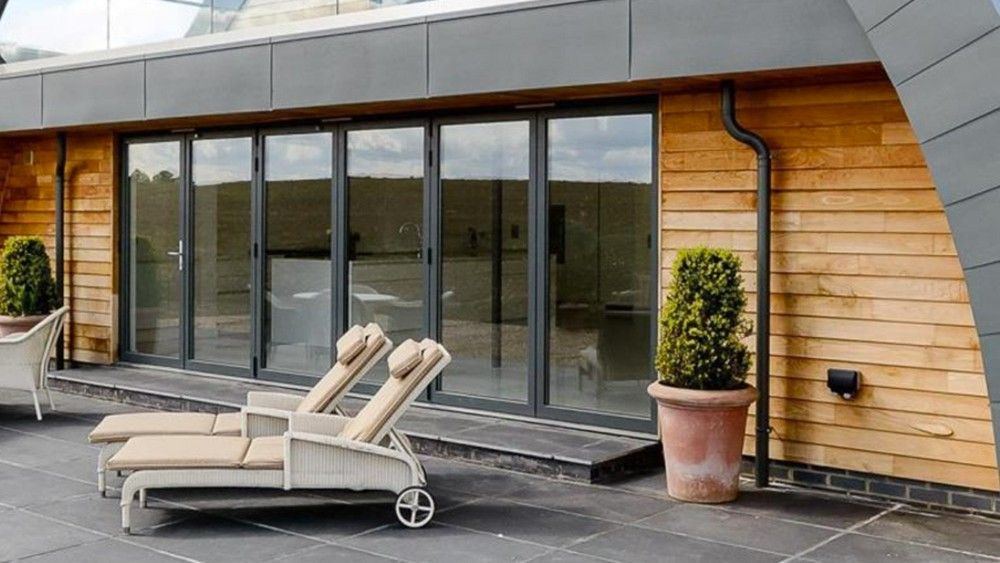 shelter with wooden wall and glass window slide