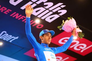 JESI ITALY MAY 17 Diego Rosa of Italy and EoloKometa Cycling Team celebrates winning the blue mountain jersey on the podium ceremony after the 105th Giro dItalia 2022 Stage 10 a 196km stage from Pescara to Jesi 95m Giro WorldTour on May 17 2022 in Jesi Italy Photo by Michael SteeleGetty Images
