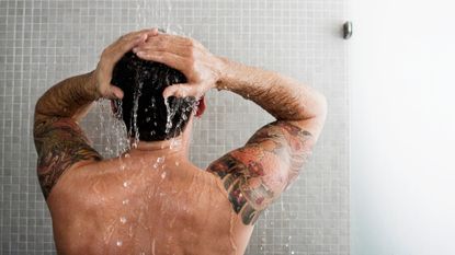 Man taking a cold shower