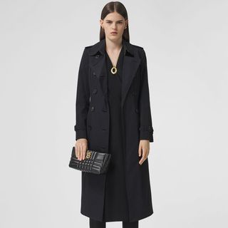 Long black Burberry trench coat, The Chelsea pictured on a model