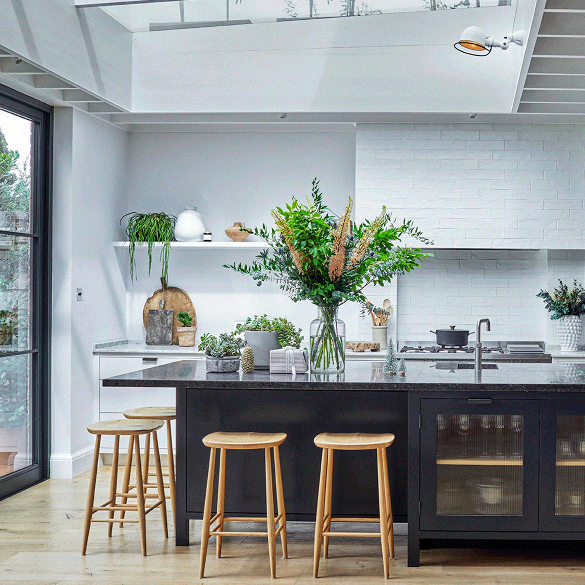 Navy blue kitchen island with wooden seats