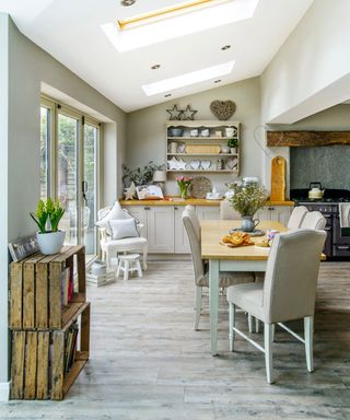 white kitchen with dining table and white chairs
