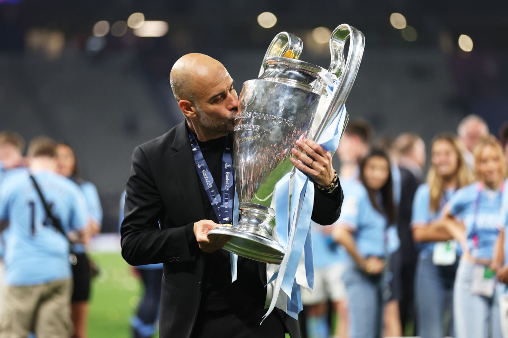Pep Guardiola, Manager of Manchester City, kisses the UEFA Champions League trophy after the team's victory during the UEFA Champions League 2022/23 final match between FC Internazionale and Manchester City FC at Atatuerk Olympic Stadium on June 10, 2023 in Istanbul, Turkey.