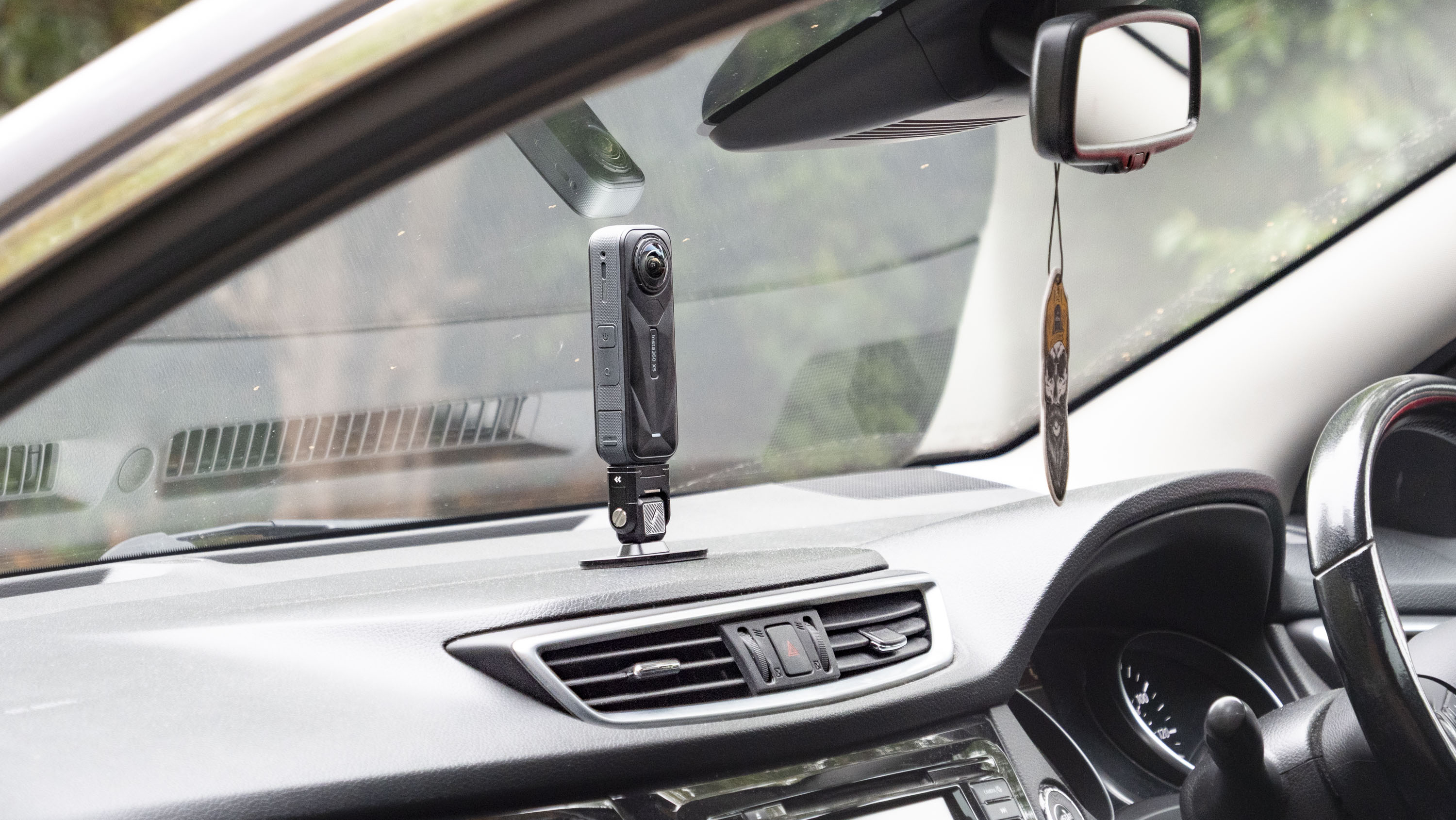 Insta360 X5 mounted to a car&#039;s dashboard