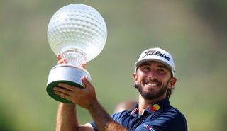 Max Homa holds the Nedbank Golf Challenge trophy aloft