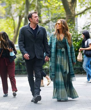 Ben Affleck and Jennifer Lopez walk while holding hands