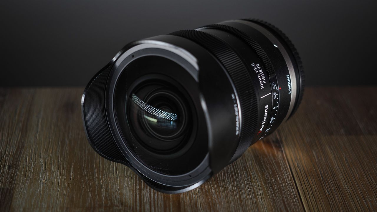 7Artisans AF 10mm f/2.5 Fisheye Max lens on a wooden surface