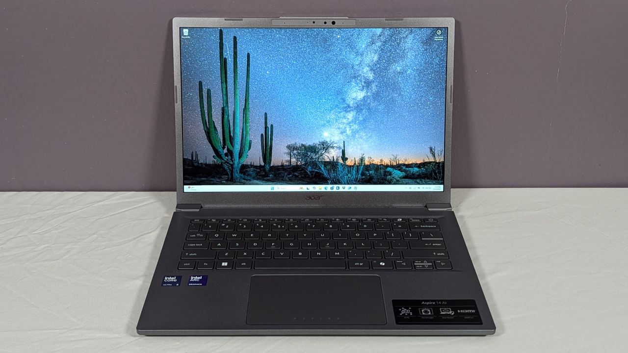 Acer Aspire 14 AI open on a white table against a gray background.