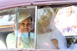 WINDSOR, ENGLAND - MAY 19: Meghan Markle (R) with her mother Doria Ragland arrives at Windsor Castle ahead of her wedding to Prince Harry on May 19, 2018 in Windsor, England. Prince Henry Charles Albert David of Wales marries Ms. Meghan Markle in a service at St George's Chapel inside the grounds of Windsor Castle. Among the guests were 2200 members of the public, the royal family and Ms. Markle's Mother, Doria Ragland. (Photo by Karwai Tang/WireImage)