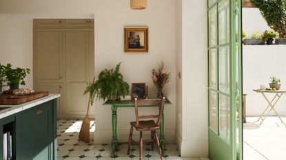 what color windows should you choose, kitchen with dark green kitchen island, desk, mint green crittall window and doors