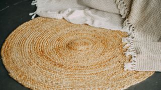 circular jute rug with blanket over