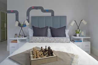 teenage boy bedroom with grey walls and chess set