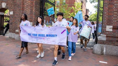 Students march through Harvard University in support of affirmative action 