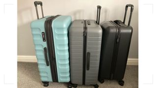 Three of the best suitcases for travel pictured after being tested