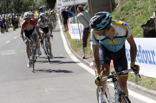 Contador glances back to see the reaction to his attack.