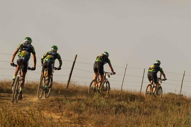 Exxaro riders Lucky Mlangeni and Nare Manamela follow another team
