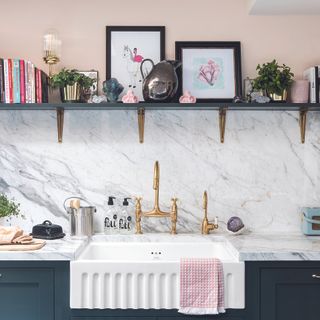 Navy kitchen with white Belfast sink and open shelving