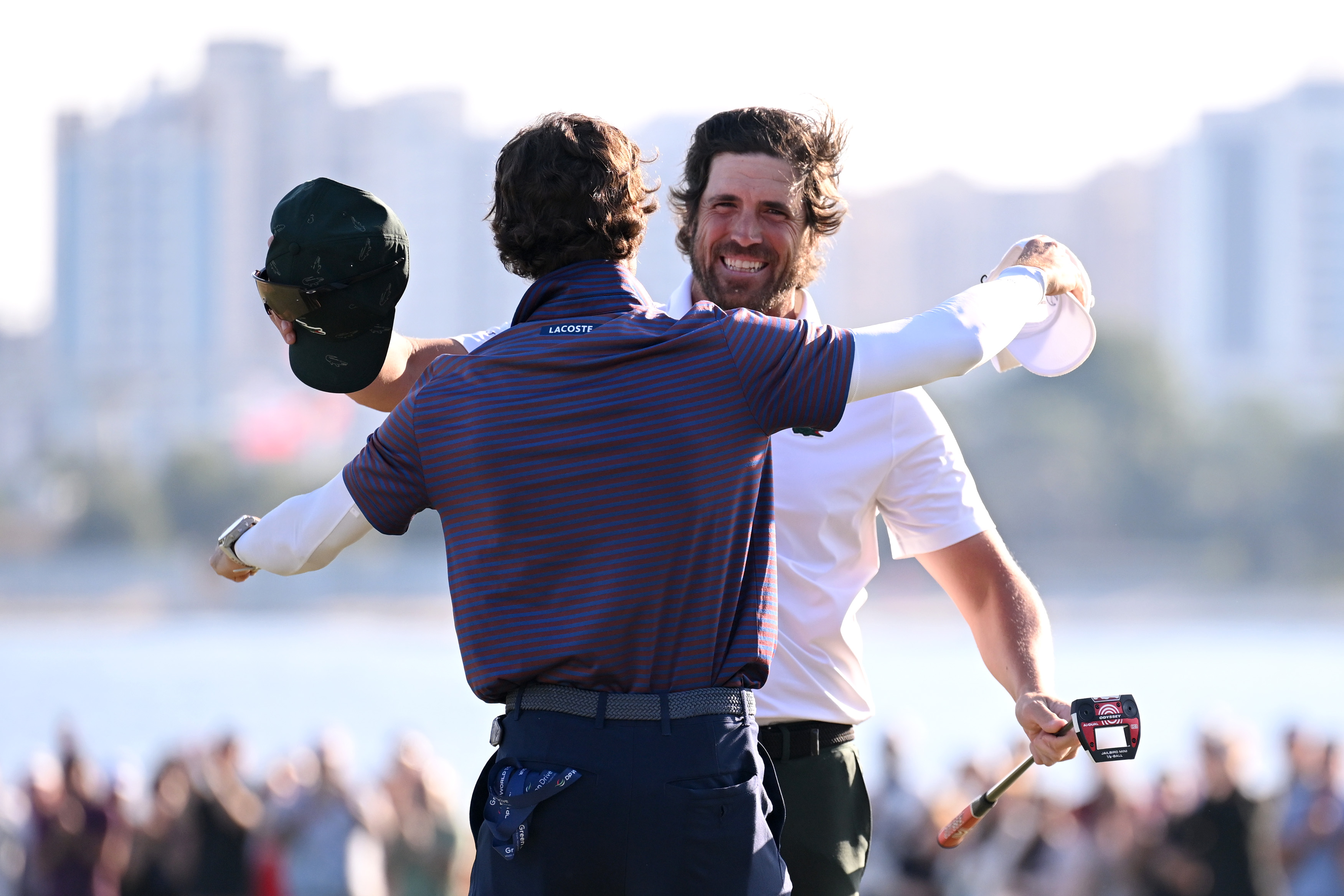 Nacho Elvira hugs his caddie after holing the winning putt