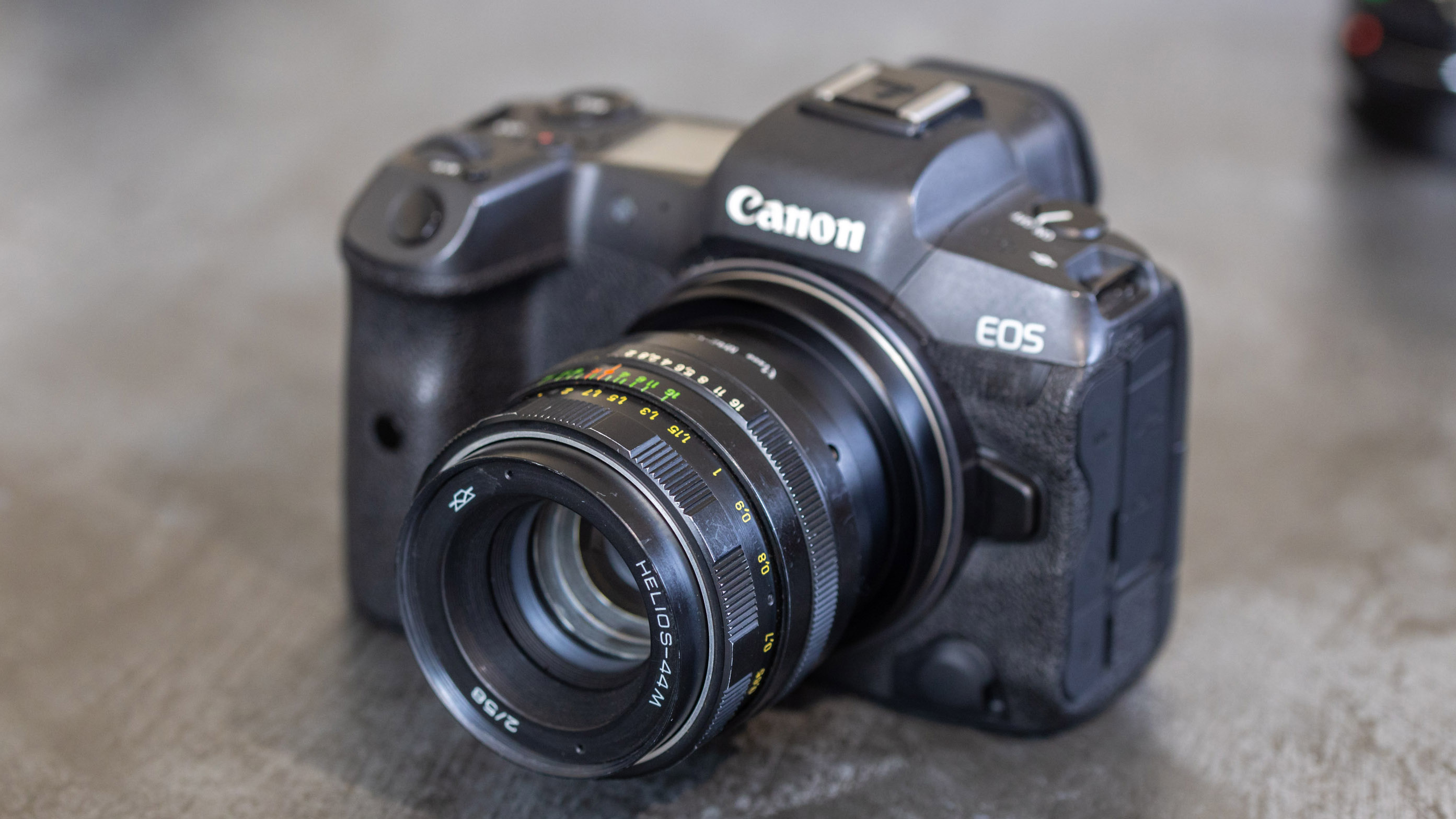 A Canon EOS R5 with a vintage old Helios lens attached to it via an adapter for Canon RF mount
